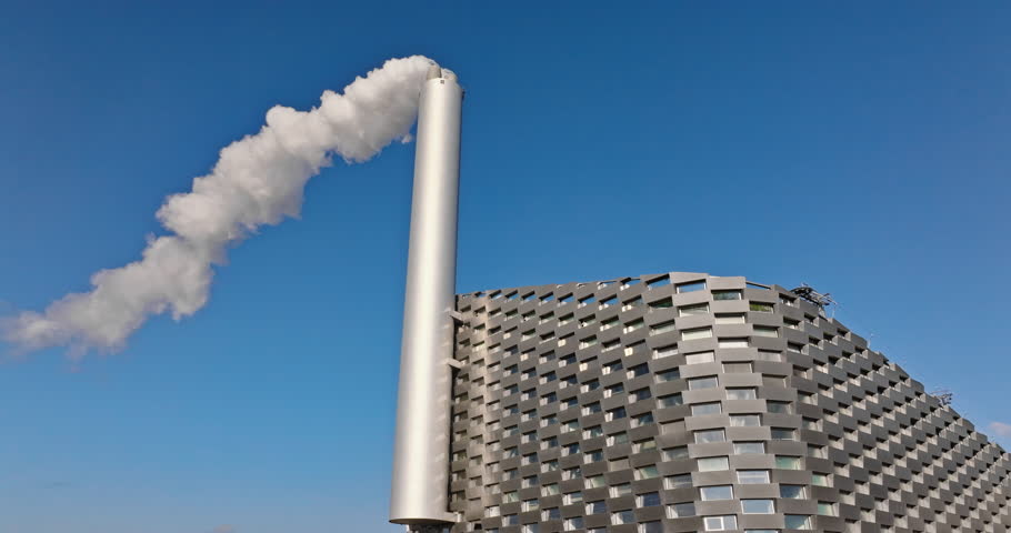 Aerial drone view of CopenHill artificial ski slope on the roof of an energy plant