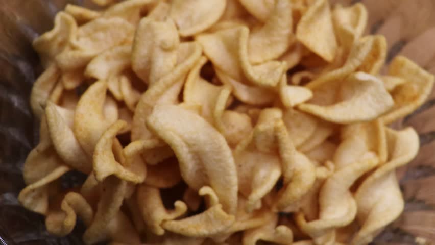 Snack potato spring chips close up. Golden chips close-up. Lots of junk food, 
