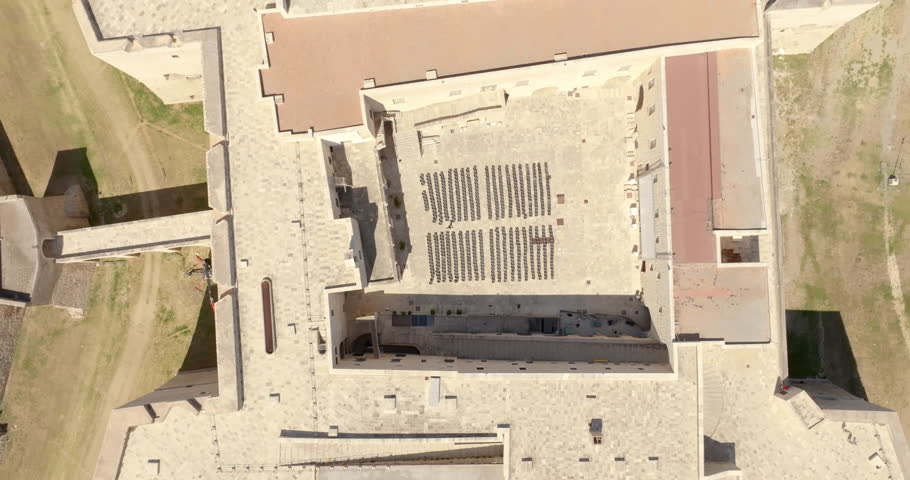 Perpendicular aerial view of the castle located in Barletta, Puglia, Italy. It was a medieval fortress built for defense and today it is a museum. There is a park around the fort.