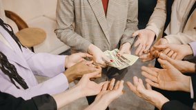 Close up of a business professionals hands holding and distributing cash, symbolizing corporate success, teamwork, and financial achievement - Powered by Shutterstock - Get 15% off with code: PIKWIZARD15