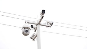 View of outdoor CCTV surveillance cameras mounted on a pole, observing the surroundings in China. Showcasing modern security technology and monitoring infrastructure. - Powered by Shutterstock - Get 15% off with code: PIKWIZARD15