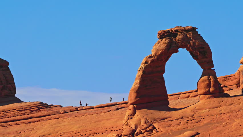 Delicate Arch in Arches national park, Utah, with panning motion. Delicate Arch is a 16m freestanding natural arch located in Arches National Park, near Moab in Grand County, Utah, United States