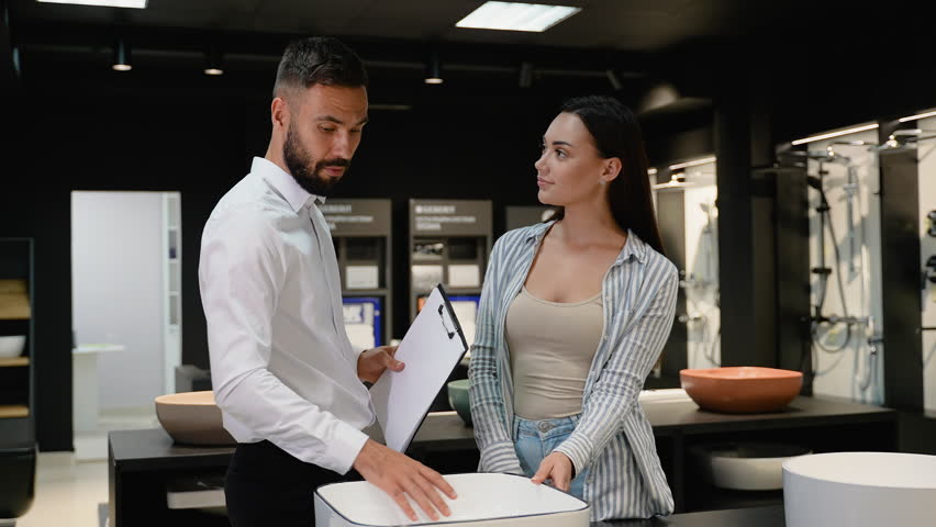 Salesman Offering Discounted Sink to Female Customer