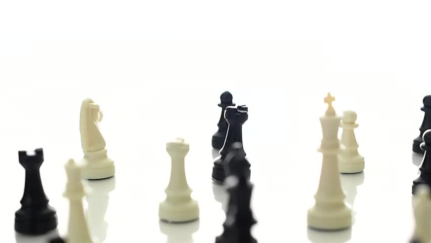 Chess pieces rotating on a white studio background.