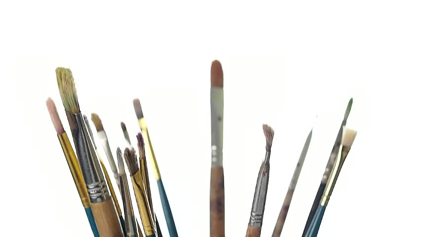 Paint brushes rotating on a pure white background