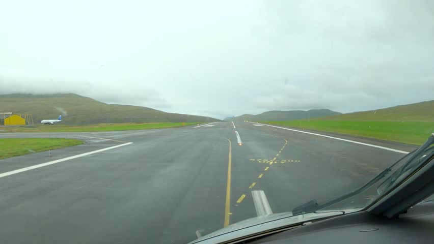 Cockpit POV Airplane Landing on Runway of Vágar in the Faroe Islands