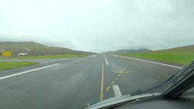 Cockpit POV Airplane Landing on Runway of Vágar in the Faroe Islands - Powered by Shutterstock - Get 15% off with code: PIKWIZARD15