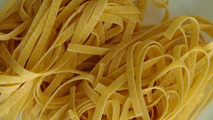 Uncooked italian pasta rotating