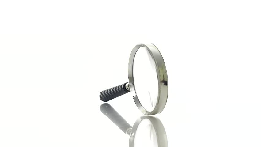 Magnifying glass rotating on a pure white background