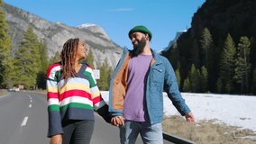 Beautiful african american couple strolls handinhand through the picturesque Yosemite Valley, surrounded by stunning beauty of winter scenery and majestic presence of El Capitan towering above them - Powered by Shutterstock - Get 15% off with code: PIKWIZARD15