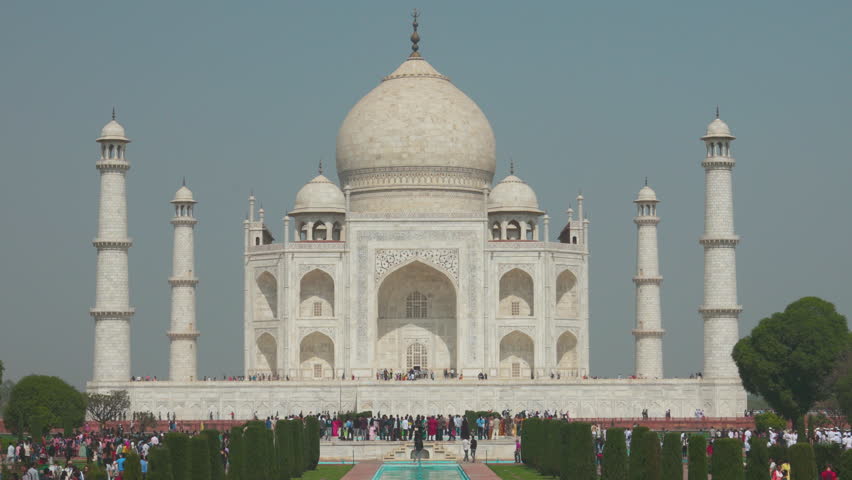 Agra, Uttar Pradesh, India. People visiting one of Seven world wonders - Fabulous Taj mahal. Famous indian islamic heritage at sunny day. Popular Place.