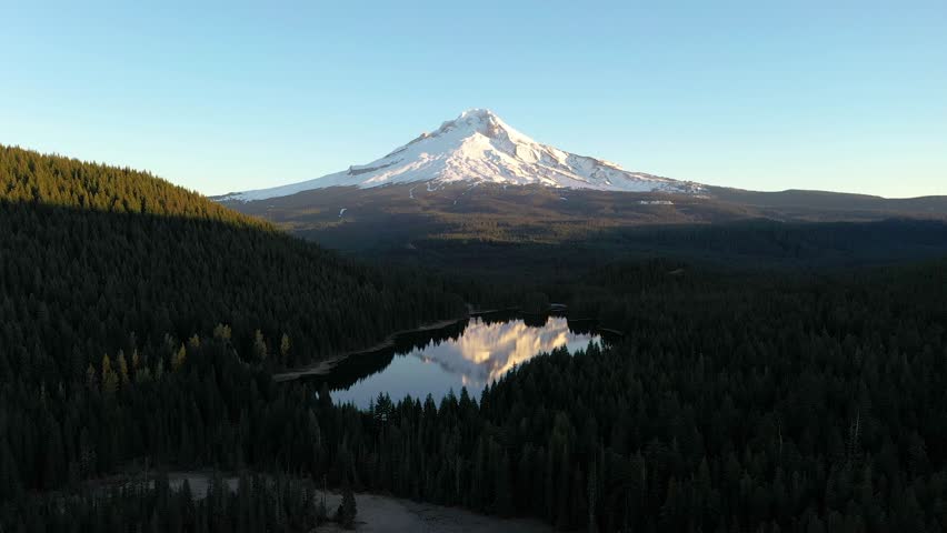 4k Aerial Drone video of Mount Hood and its reflection in Trillium Lake in Oregon, captured during sunrise. 
