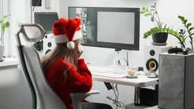 Young woman in Christmas cap creates an image using AI during New Year holidays. Technology and art: AI as tool for creating images. Modern technologies help to expand boundaries of creativity - Powered by Shutterstock - Get 15% off with code: PIKWIZARD15