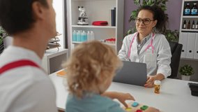 Female doctor consulting with father and young son in a modern clinical office, with prescription medication on the desk and medical equipment in the background - Powered by Shutterstock - Get 15% off with code: PIKWIZARD15