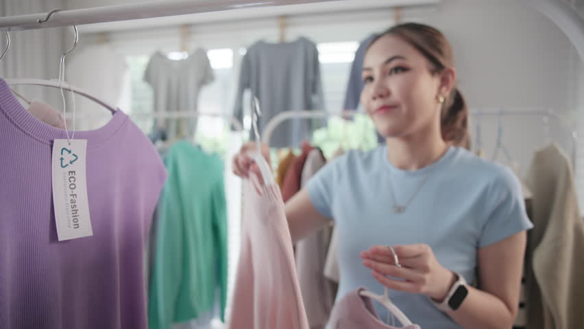 Eco slow fashion retail label second hand sale store net zero waste free go green seller. Asia people small SME owner Thrift shop tag Bio fabric shirt symbol closet product reduce gas social issue.