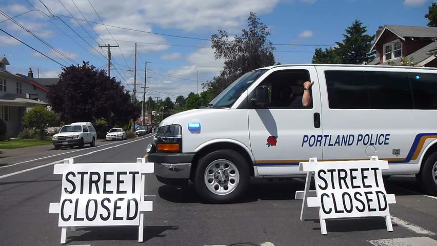 PORTLAND, OREGON - CIRCA 2012: Police van flashes lights at the scene of a road