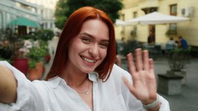 Caucasian woman girl female tourist traveler vlogger blogger influencer social media record video selfie talk mobile phone camera chat outdoors city cafe travel blog channel online stream webcam view - Powered by Shutterstock - Get 15% off with code: PIKWIZARD15