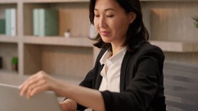 Asian smiling businesswoman adult chinese korean girl female boss sit office table open desktop computer Japanese business woman employer start working day email typing laptop morning online pc work - Powered by Shutterstock - Get 15% off with code: PIKWIZARD15