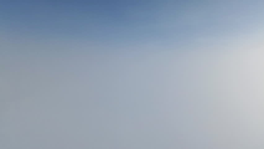 Winter A tranquil video of winter fog merging with a clear blue sky, creating a serene and ethereal atmosphere. Perfect for use in relaxation content, weather-related media,or as a backdrop for winter