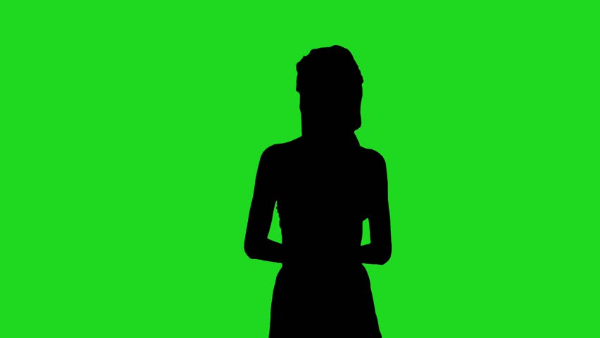 silhouette of a women standing  and talking action against a bright green background