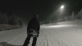 Night cross country ski workout. Footage. Young woman man at night on the highlighted cross country ski track. Aerial. - Powered by Shutterstock - Get 15% off with code: PIKWIZARD15
