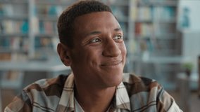 African American man male student library knowledge think contemplation new idea inspiration guy touching chin brainstorming imagination decisions high school university studying learning bookshelf - Powered by Shutterstock - Get 15% off with code: PIKWIZARD15