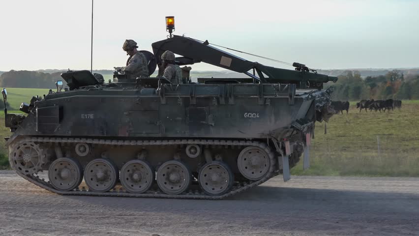 British army FV434 mechanized Armoured Repair Vehicle in motion on a military exercise, Wilts UK