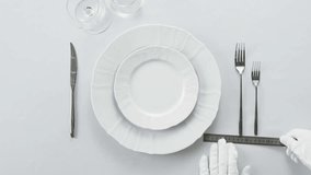 Flawless table setting with white gloves sophisticated dining experience arrangement - Powered by Shutterstock - Get 15% off with code: PIKWIZARD15