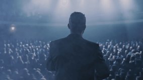 Business Leader Speaking To Large Crowd In Dark Atmospheric Environment Leadership Success - Powered by Shutterstock - Get 15% off with code: PIKWIZARD15