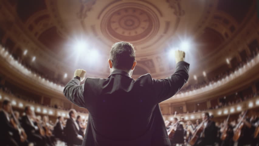 Orchestra Conductor Leading Symphony Performance In Grand Concert Hall Music Entertainment Passion