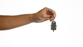 Hand holding new house key over isolated white background indicating real estate purchase or rental - Powered by Shutterstock - Get 15% off with code: PIKWIZARD15