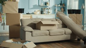 A Man Experiences Back Pain While Bending Over to Unpack Moving Boxes. This Scene Highlights the Physical Strain and Common Challenges of Moving Heavy Items During a Relocation. - Powered by Shutterstock - Get 15% off with code: PIKWIZARD15