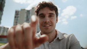 Caucasian man male guy city looking at camera screen display touchscreen view scrolling swipe front interface tapping gesture futuristic cyberspace AR tech hand touching sliding businessman business - Powered by Shutterstock - Get 15% off with code: PIKWIZARD15