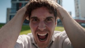 Close up angry Caucasian man male mad shouting at camera guy screaming stress city negative emotions anger face aggressive furious scream irritation problem shout yell rage outside crazy distraught - Powered by Shutterstock - Get 15% off with code: PIKWIZARD15
