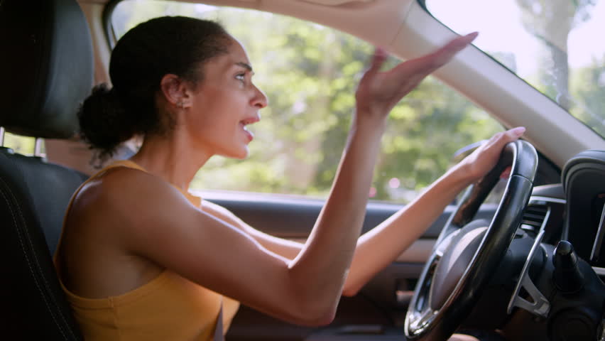 Angry African American woman female businesswoman shouting traffic jam conflict road driver auto car vehicle transport horn wheel accident signal annoyed warning steering girl screaming business city