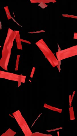 Big falling shiny red confetti isolated on transparent video black background Portrait. Bright festive tinsel of red color