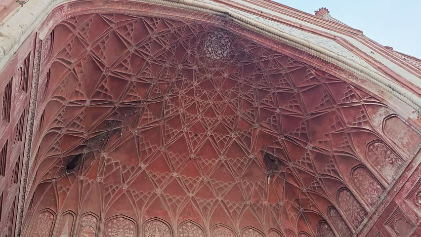 25 Feb 2024- Painted Incisions Inside the Red Sandstone's Arched Entrance gate.