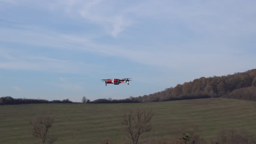Remotely controlled drone with camera system in full operation