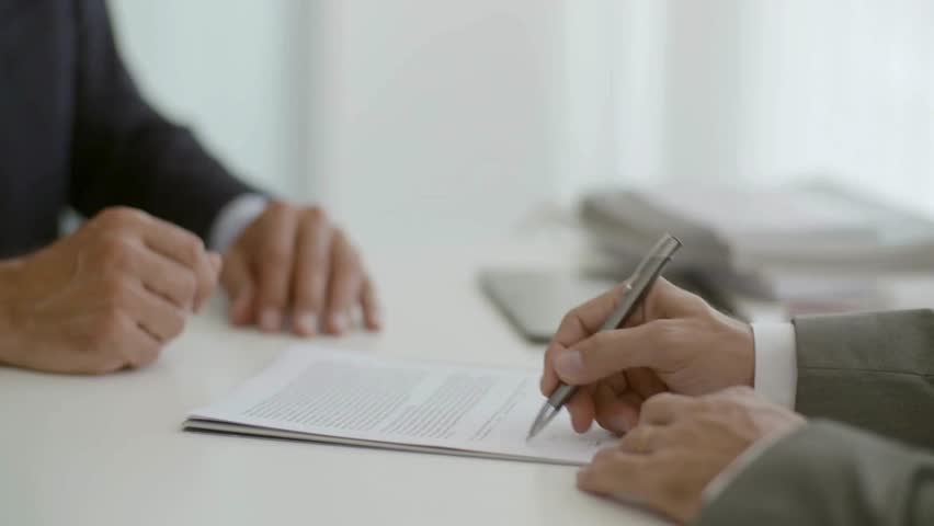 hand signing a contract Write Business Agreement or Undersign Protocol of Convention. questionary declaration at report after checking information.