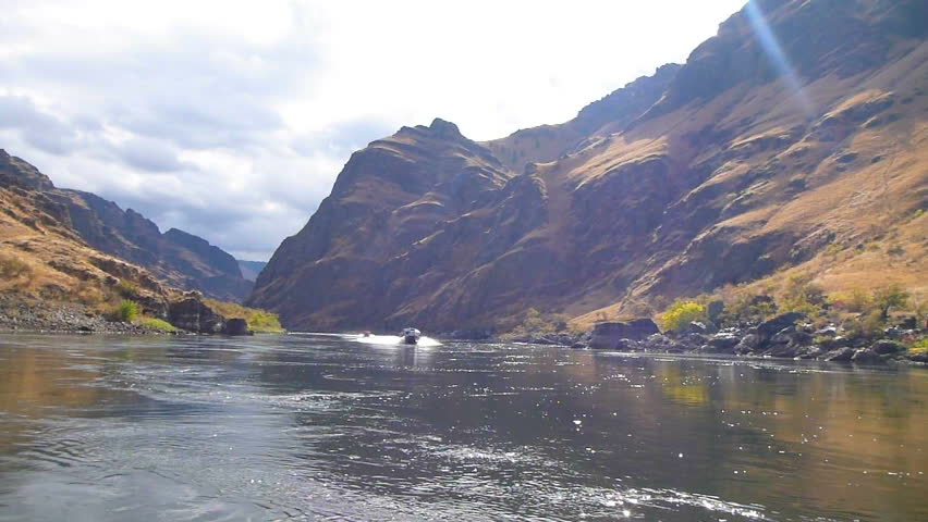 Two jet boats traveling down Snake River in Hell's Canyon.