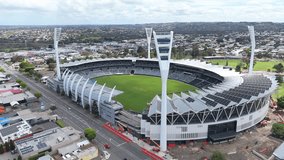 Soaring high above the cricket stadium, this footage captures the calm, empty stands and the lush green field, showcasing the venue’s beauty in a tranquil state. - Powered by Shutterstock - Get 15% off with code: PIKWIZARD15