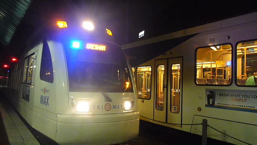 PORTLAND, OREGON - CIRCA 2012: Night exterior with metro trains traveling on