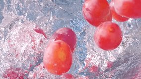 Fresh organic red grapes splashing into water in slow motion 300fps - Powered by Shutterstock - Get 15% off with code: PIKWIZARD15