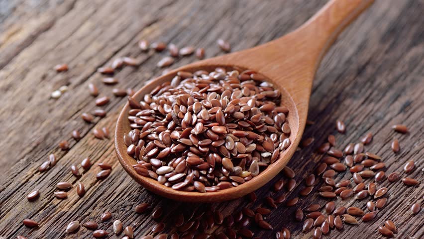 flax seed on wooden background