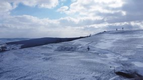 Flying above snowie hillside. Winter landscape in the rural area of Transylvania, Romania - Powered by Shutterstock - Get 15% off with code: PIKWIZARD15