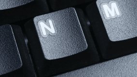 N Character or letter Key on Desktop Keyboard Pressed by Finger Hand Multiple Times - Close Up Macro Shot - Powered by Shutterstock - Get 15% off with code: PIKWIZARD15