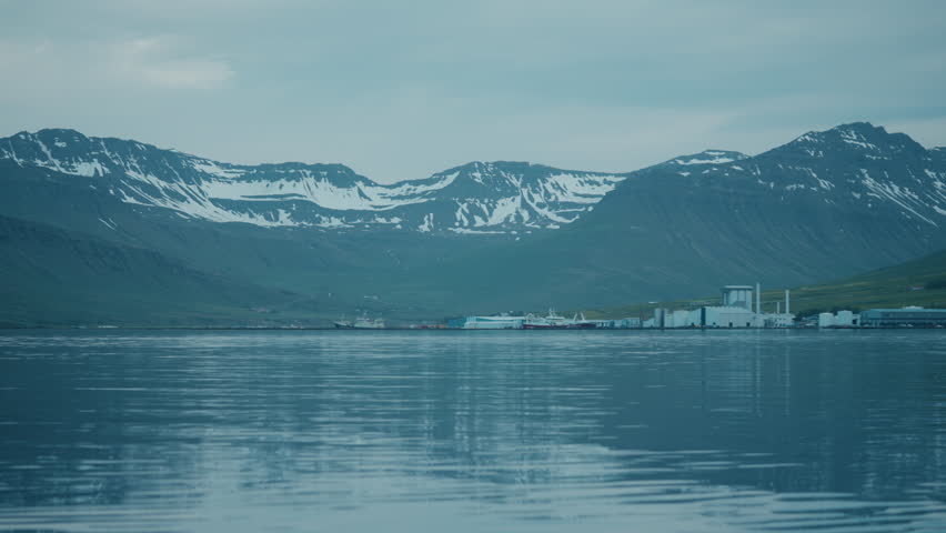 Static shot of Neskaupstaður landscape, east Iceland, water, ice, mountains, reflections