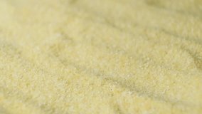 Uncooked semolina cereal pouring, macro slow motion - Powered by Shutterstock - Get 15% off with code: PIKWIZARD15