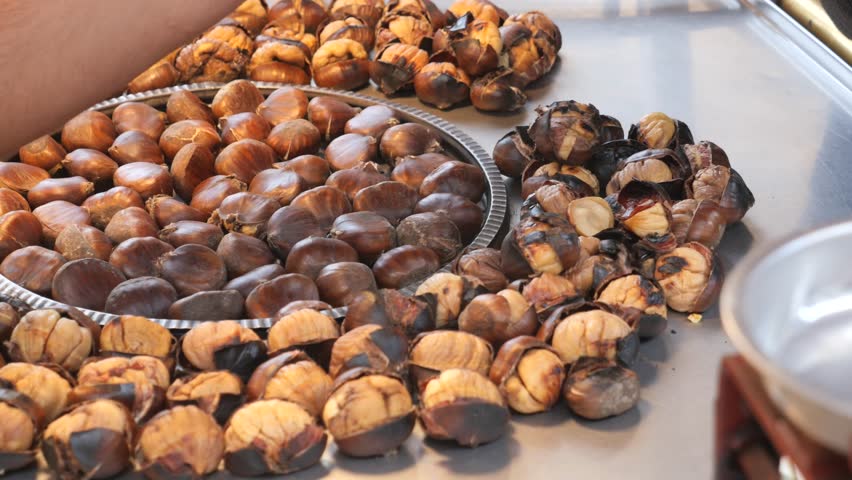 traditional Istanbul street food grilled chestnuts in a row