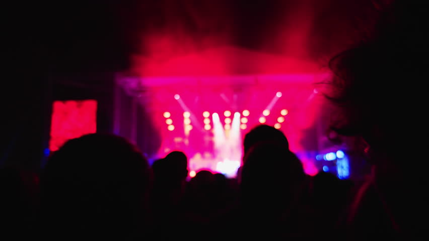 A Blurred Concert Experience Filled with Vibrant and Colorful Stage Lights That Create an Exciting, Lively Atmosphere